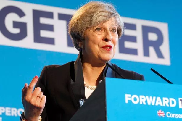 What does Theresa May mean by a "great meritocracy"